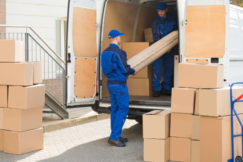 Removal team preparing safely with packing equipment and protective gear
