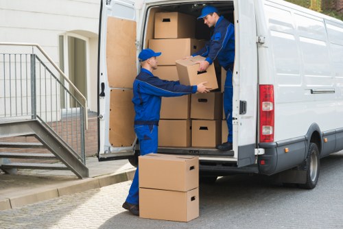 Local moving team handling boxes and furniture in Lambeth