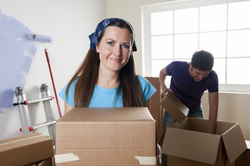 Removal crew loading household items into a moving van