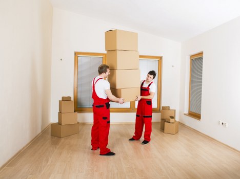 Professional movers loading furniture near a Lambeth property