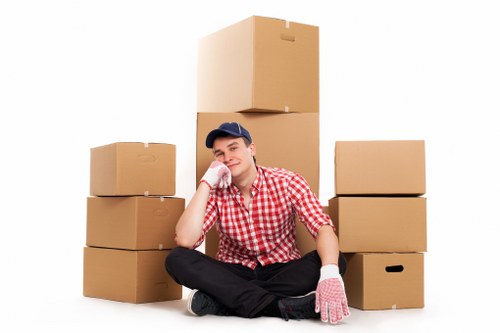 Local removals professionals handling boxes in Lambeth