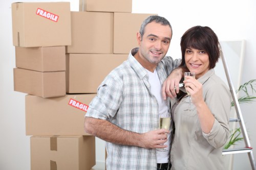 Removal team handling furniture and boxes in a Lambeth flat move